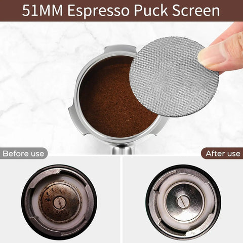 Front view of a 51mm stainless steel bottomless portafilter with puck screen and coffee grounds