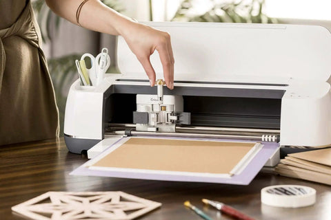 Knife Blade And Drive Housing For Makers Compatible With Cricut Maker Cutting Machine in action cutting chipboard on a table
