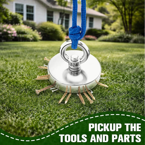 1000 Lb Neodymium Fishing Magnet With Countersunk Eyebolt on lawn with attached nails, blue rope visible