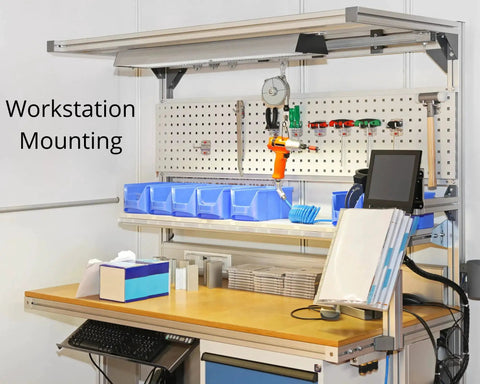Workstation with tools and storage boxes mounted on pegboard, showcasing ergonomic setup and organized workspace.