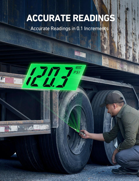 AstroAI digital tire pressure gauge with neon green backlit LCD displaying 120.3 PSI on a truck tire.