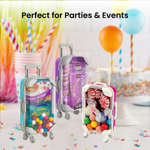 Three mini suitcase party favor boxes with wheels and candy, ideal for parties and events.