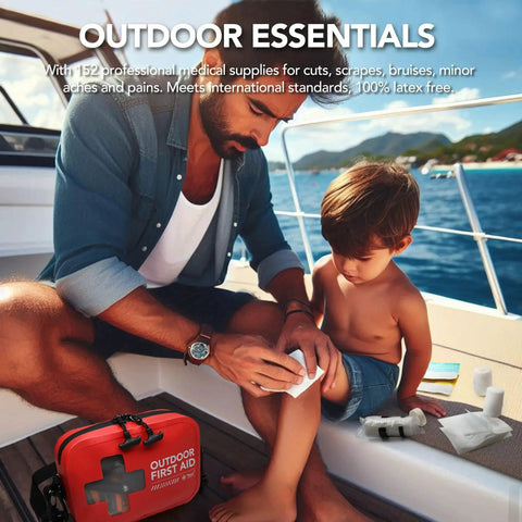Father using Waterproof 152 Piece First Aid Kit in Red Portable Dry Bag on a child's knee on a boat.