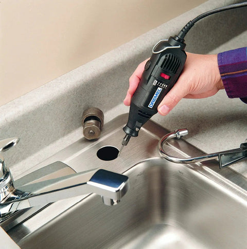 Person using rotary tool with Heavy Duty Tungsten Carbide Cutter Bit for crafting on kitchen counter