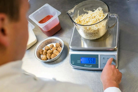 Heavy Duty Spill Proof Digital Kitchen And Industrial Scale With 66 Lb Capacity Dual Front And Rear Display Stainless Steel NSF Certified Pro Grade Precision for weighing ingredients in a commercial kitchen.