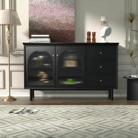 Modern black sideboard with arched glass doors and antique brass knobs, set in an elegant living room with decor accents.