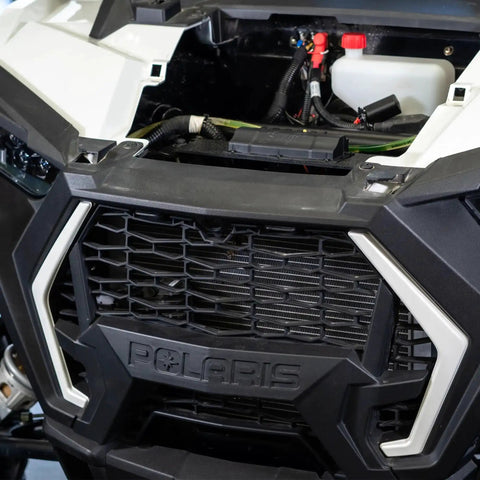 Close-up of open front vehicle compartment showing wiring setup for 4 Channel 100 Amp Solid State Relay Block for Marine, Powersports and Car Accessories.