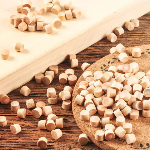 200 Piece Flat Head Wooden Screw Hole Plugs Three Eighths Inch Diameter One Quarter Inch Deep For Furniture Repair on wood surface