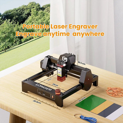 Ray5 Mini Laser Engraver Pro Grade Dope With Ultra Fine 0.04mm Spot And 12000mm Per Minute Speed on desk with measuring tape and colored sheets