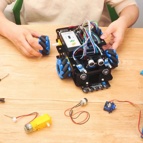 Person assembling Mecanum Wheels Omni Directional Robot Car Kit For Arduino Mega2560 STEM Education Remote Controlled DIY Coding Learning