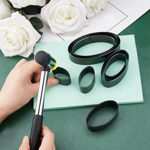 Elliptical Leather Punch Tool Set With Cutting Dies For Hole Punching High Carbon Steel DIY Leather Craft Kit displayed with flowers