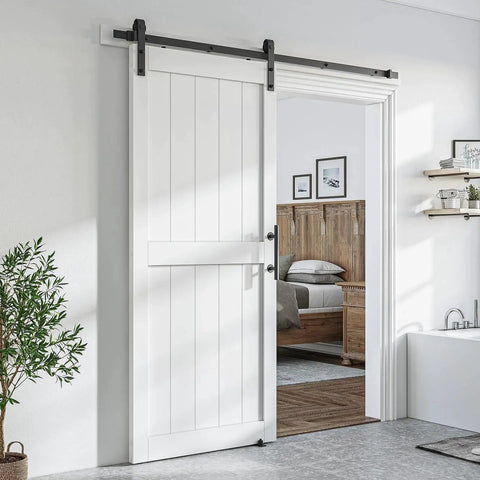 36 By 84 Inch White Sliding MDF Barn Door With Six Point Six Foot Black Sliding Door Hardware Kit And Handle Pre Drilled Ready To Assemble Waterproof PVC Coating shown installed in a living space.