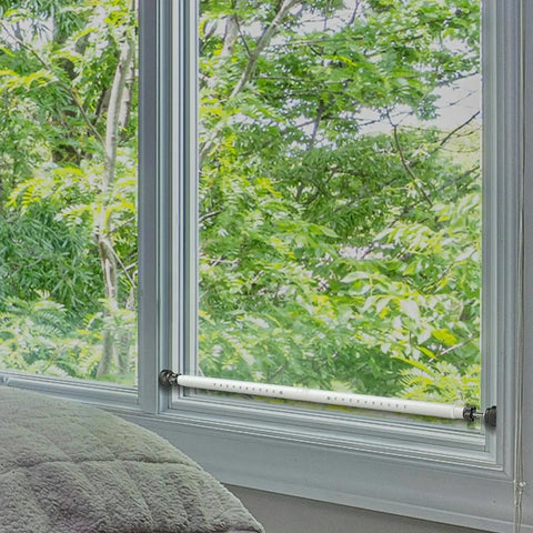 Two Pack Sliding Glass Door Security Bar Adjustable White Updated Model Fits 16.5 To 51 Inches For Home Safety And Childproofing installed on window