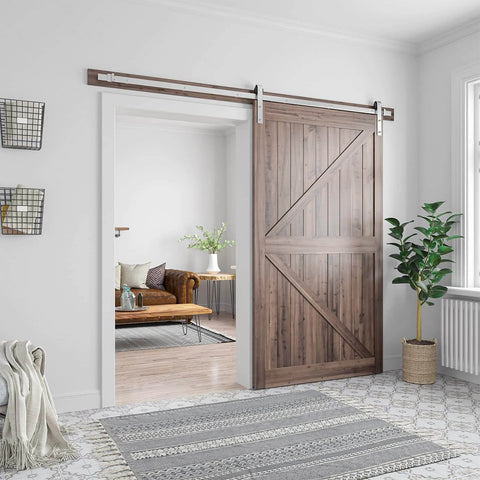 Interior view showing 8 Feet Brushed Nickel Barn Door Hardware Kit for 42 to 48 inch wide panels, installed in a living room doorway.