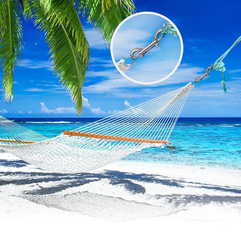A hammock hung by a 30 Pack 3.5 Inch Double Ended Bolt Snaps Zinc Alloy Key Chain Clips With Trigger on a tropical beach.