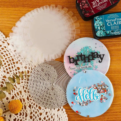Flat Shaker Covers and Nesting Circle Dies with acetate sheets for shaker card making and scrapbooking on a wooden table.