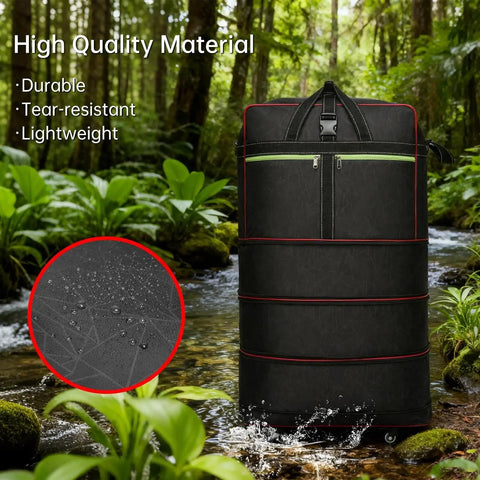 Foldable Duffle Bag With Wheels Large Expandable Travel Duffle Waterproof in forest setting, showing durable black nylon material.