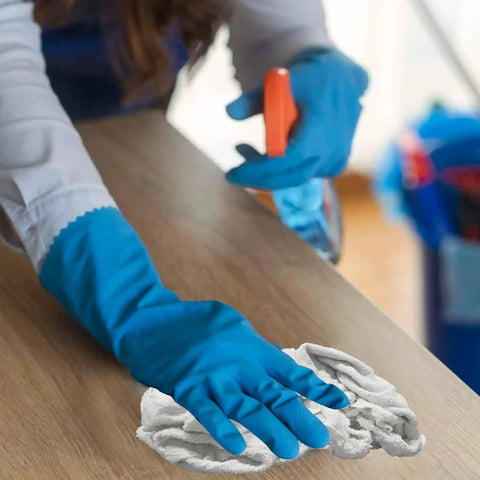Person cleaning a wooden surface with Premium White Terry Cloth Rags For Spills And Cleanup In The Garage Shop And Home Go To Multipurpose
