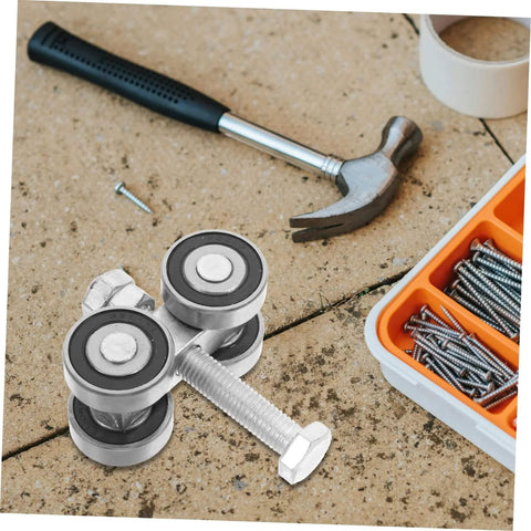 Stainless Steel Double Bearing Sliding Door Caster Wheel Kit For Ultra Smooth Rolling shown with tools on a concrete surface