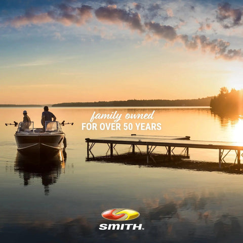 Two people in a boat near a dock at sunset with the text 'family owned for over 50 years' and 'Smith' branding.
