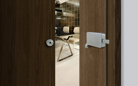 Surface Jamb Mount Door Lock For Barn And Interior Doors on wooden door, privacy hardware in graphite black finish, office setting