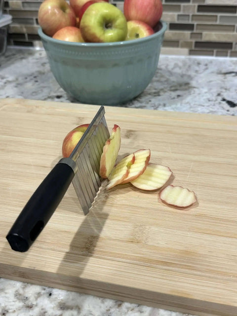 Crinkle Cut Wavy Blade Slicer For Fries And Veggies Stainless Steel French Fry Cutter Kitchen Tool slicing apple on cutting board