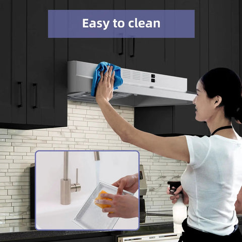 Person cleaning 30 Inch Under Cabinet Range Hood Stainless Convertible Ducted Ductless 300 CFM in kitchen
