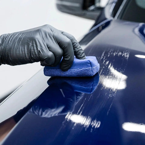 Applying Gyeon Mohs Ceramic Coating Kit For Cars DIY Deep Gloss And 3 Year Protection on blue car hood