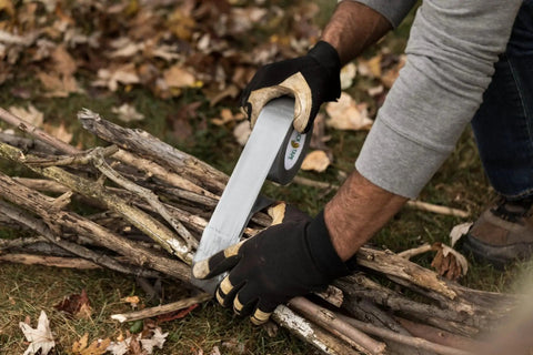 Person using Duct Tape 1.88 Inch By 60 Yard Silver For Quick Repairs And Sealing to bundle sticks outdoors