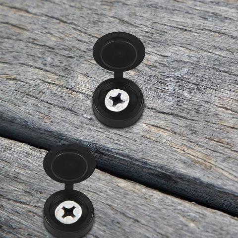 Hinged Plastic Screw Cover Caps With Shutter Fold Design on wood surface, showing black snap-on tops concealing screws for furniture.