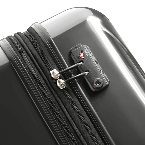Close-up of lightweight expandable hardside luggage with four double spinner wheels and a crack resistant polycarbonate shell in brushed charcoal