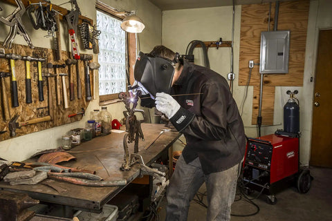 Welder using Viking Industrial Passive Black Welding Helmet For MIG TIG And Stick Welding in workshop, heavy-duty build.