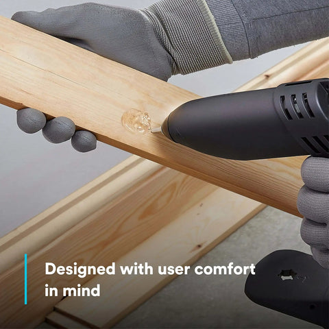 Single-unit industrial hot-melt applicator TC/TC-Q GEN II 120V PTC self-regulating heater used on wood surface with ergonomic grip