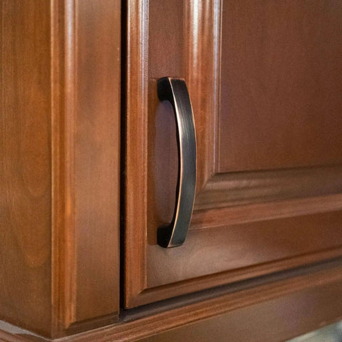 Solid Zinc Alloy Kitchen Cabinet Pull Handle in Oil Rubbed Bronze Simplicity Series Traditional Classic Design four and three eighths inch on wood cabinet