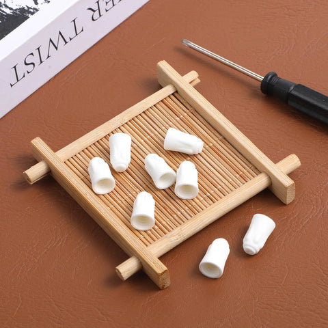 25pcs ceramic wire connectors, porcelain wire caps for 22-14 AWG, small white caps laid on bamboo tray with screwdriver