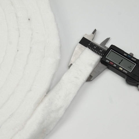 Lynn Manufacturing white ceramic fiber strip blanket, 1 in x 1/2 in, high-temp gasketing, shown with digital caliper