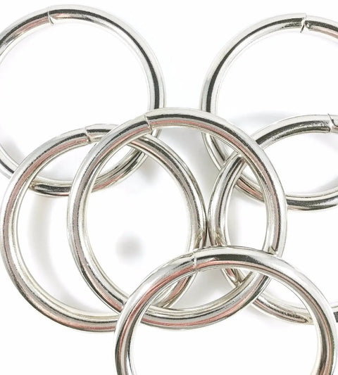 Welded Nickel Plate Steel O Rings Two And A Half Inch ID Heavy Duty 12 Pcs stacked close-up view