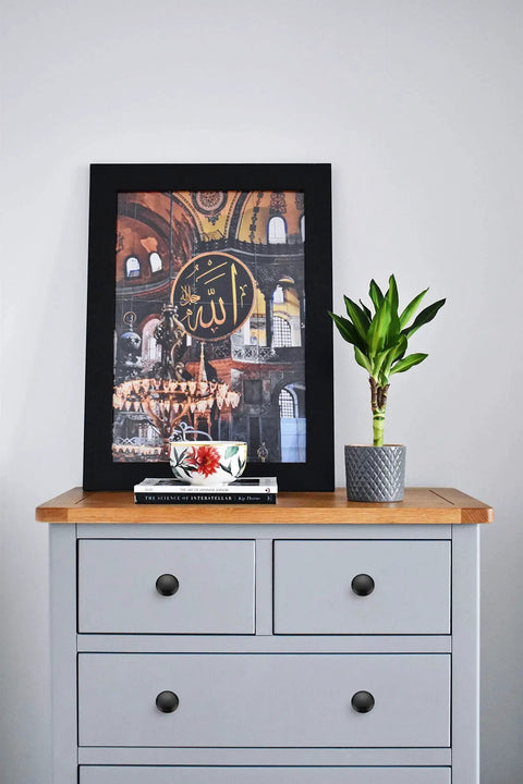 Matte Black Zinc Kitchen Cabinet Knobs And Drawer Pulls Set, 30 Pack displayed on light gray dresser with framed artwork.