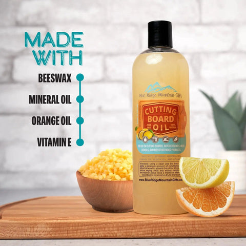 Cutting board oil bottle with label about ingredients: beeswax, mineral oil, orange oil, and vitamin E, next to citrus slices.