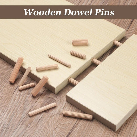 Five Sixteenths Inch Wood Dowel Pins Set With 225 Pieces Kiln Dried Hardwood Fluted Beveled Dowels scattered on wood surface.