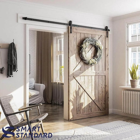 8.2 FT Sliding Barn Door Hardware Kit with J Shape hanger, installed on wooden door, showcasing modern space saving design in living room