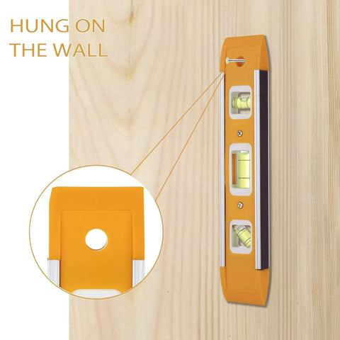 Nine Inch Magnetic Torpedo Level With Three Bubble Vials For Horizontal Vertical And 45 Degree Readings Shock Resistant ABS Frame Heavy Duty Magnetic Base Bright Orange On Site Construction And Woodworking Tool For Precise Layouts hung on wall