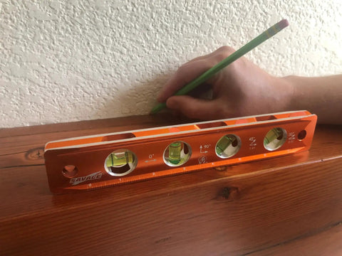 Savage 9 Inch Magnetic Torpedo Level With Four Neodymium Magnets And Four Vials For 30 Degree Conduit Bends Built From Solid Aluminum For Lifetime Durability Bright Orange Finish For Easy Visibility On Any Job Site on wood surface