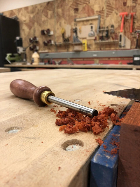 Pro Grade Cabinet Scraper Burnisher Tool With Hard Maple Handle And Super Hard High Speed Steel Rod on a woodworking bench