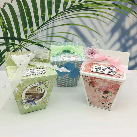 Colorful decorated gift boxes made with Milk Box Gift Box Die Cut Set For Paper Craft And Scrapbooking, featuring floral designs and ribbons.