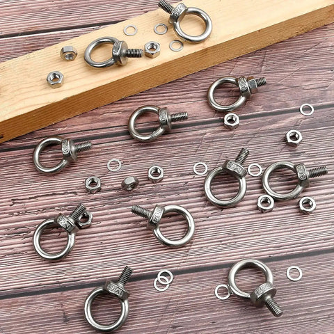 20 Pack Stainless Steel M6 Eye Bolts With Nuts And Washers For Lifting And Suspension Shoulder Ring Eyebolts on wooden surface