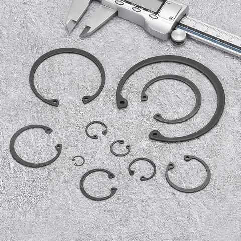 Five Pack Internal Retaining Ring Circlip Set 2.52 Inch Outer Diameter 2.25 Inch Inner Hole 0.08 Inch Thick 65Mn Spring Steel With Black Oxide Finish For Grooved Shafts And Studs displayed on grey surface with caliper