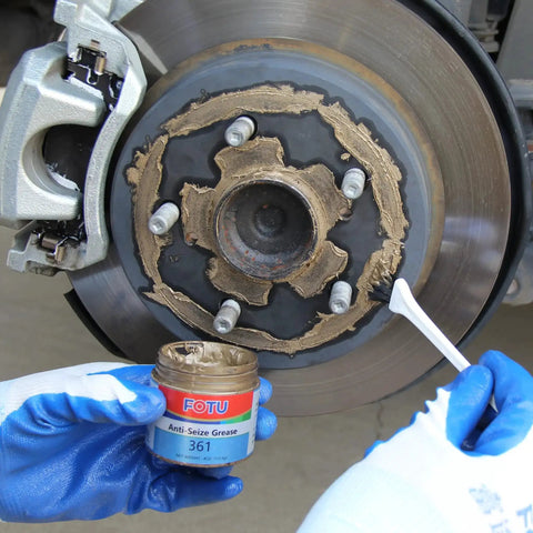 Applying 361 High Temperature Copper Anti Seize from Complete Brake Caliper Grease Kit to brake disc for smooth performance