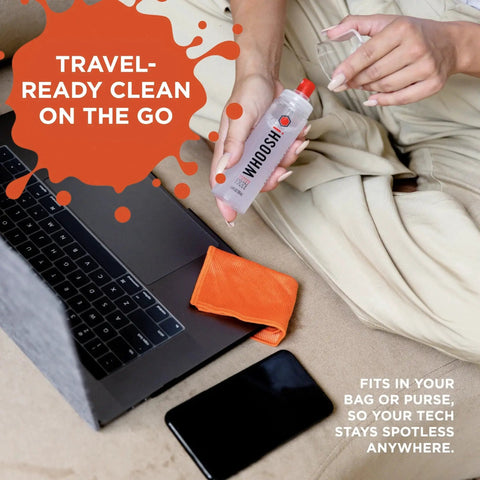 Person using Screen Shine Duo XL Safe For All Screens And Lenses Cleaner Spray And Wipes with laptop and phone nearby.
