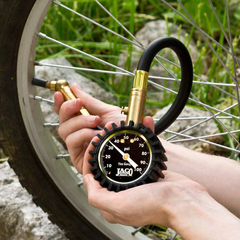 JACO ElitePro tire pressure gauge with brass body and black rubber guard for bicycle tires